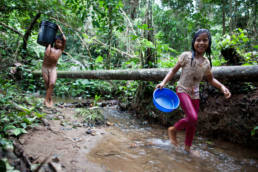 Waorani children collect water near the community of Yawepare, 2013